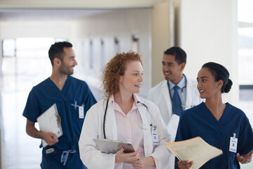 Hospital staff talking in hallway