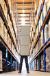 © Paul Bradbury/KOTO - Worker holding boxes in warehouse