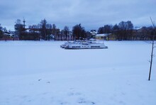 Winter Landscape With A Frozen Boat