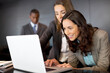 © Tom Merton/KOTO - Businesswomen using laptop in office