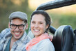 © Martin Barraud/KOTO - Portrait of smiling couple in sport utility vehicle
