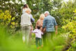 © Lee Edwards/KOTO - Multi-generation family walking in park