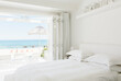 Modern bedroom overlooking beach and ocean