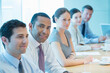 © Chris Ryan/KOTO - Business people smiling in meeting