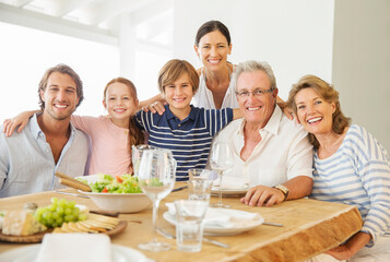 Poster - Multi-generation family smiling together at table