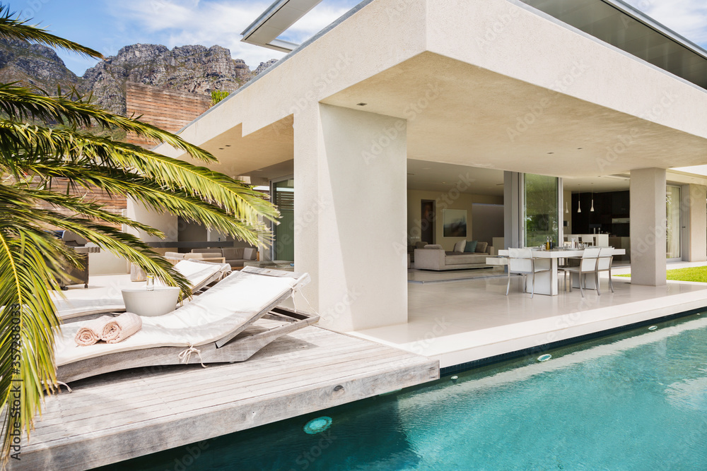 Swimming pool and patio of modern house - obrazy, fototapety, plakaty 