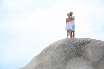 Wall Mural - Couple hugging on rock formation