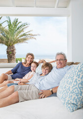 Poster - Older couple with grandchildren on sofa