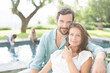 © Tom Merton/KOTO - Couple relaxing at poolside