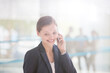 © Tom Merton/KOTO - Businesswoman talking on cell phone