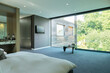 © Astronaut Images/KOTO - Glass wall of bedroom in modern house