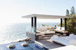 © Martin Barraud/KOTO - Woman relaxing in cabana overlooking ocean