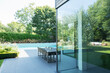 © Astronaut Images/KOTO - Table and chairs on patio by swimming pool