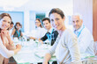 © Martin Barraud/KOTO - Business people smiling in meeting