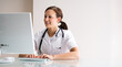 © Andrey Popov - Happy Attractive Physician Doctor Working At Computer