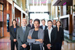 © Martin Barraud/KOTO - Business people smiling in lobby