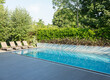 © Astronaut Images/KOTO - Lounge chairs by luxury lap pool