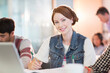 © Tom Merton/KOTO - University student smiling in classroom
