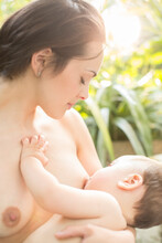 Mother Breast-feeding Baby Boy