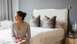 © Astronaut Images/KOTO - Woman writing in bedroom