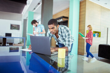 Man working on laptop in office