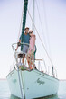 © Robert Daly/KOTO - Couple standing on front of boat