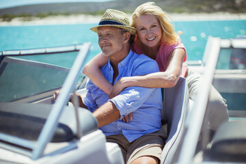 Older couple relaxing on boat 