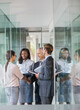 © Dan Dalton/KOTO - Business people talking in office building