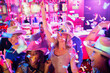 © Dan Dalton/KOTO - Confetti falling on women wearing cowboy hats dancing in nightclub