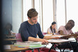 © David Schaffer/KOTO - University student taking exam, students in background writing