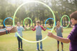 © Tom Merton/KOTO - Team connected in circle by plastic hoops