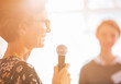 © Martin Barraud/KOTO - Close up woman speaking with microphone