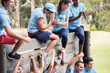 © Sam Edwards/KOTO - Cheering team at wall on boot camp obstacle course