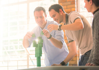 Wall Mural - Businessmen balancing green blocks