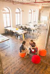 Wall Mural - Casual businessmen meeting in open office