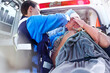 © Trevor Adeline/KOTO - Rescue worker tending to patient at back of ambulance