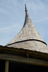 Wall Mural - Sharpen cone on top of a cottage