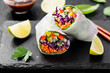 Vegetarian vietnamese spring rolls with peanut butter sauce, carrot, cucumber, red cabbage and rice noodle. Vegan food. 
