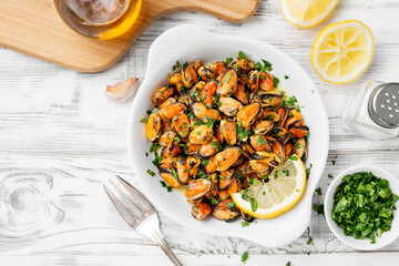 Delicious seafood mussels with lemon and parsley.