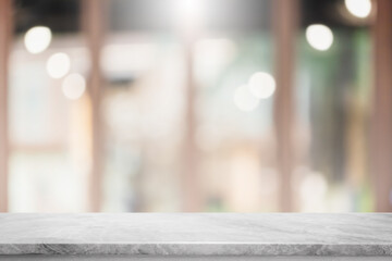 Empty white marble stone table top and blur glass window interior restaurant banner mock up abstract background - can used for display or montage your products.