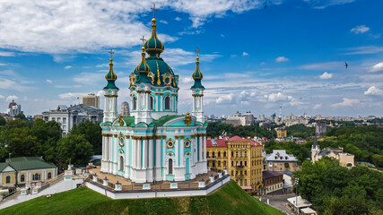 Aerial drone view of Saint Andrew's church and Andreevska street from above, cityscape of Podol district, city of Kiev (Kyiv), Ukraine
