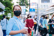 © Hide_Studio - young asian woman with mask  walking in the Bangkok city