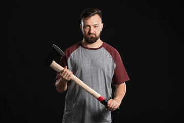 Handsome lumberjack on dark background