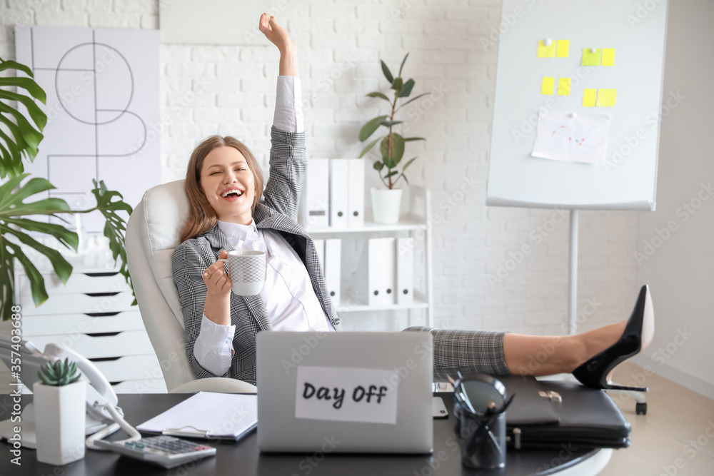 Happy businesswoman before weekends in office