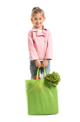 Wall Mural - Little girl with food in bag on white background