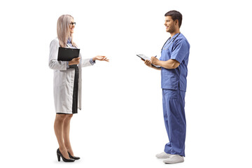 Poster - Female and male doctor having a conversatio