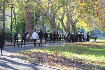 Sydney, NSW / Australia - June 6 2020: Black Lives Matter Protest March. Protesting Aboriginal deaths in custody and the death of. Procession of protestors walking to the rally.