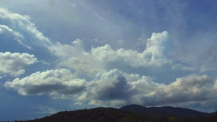 Wall Mural - Time Lapse of  beautiful blue sky with a clouds above hill canopy, nature background. Sky with clouds summer weather nature cloud blue