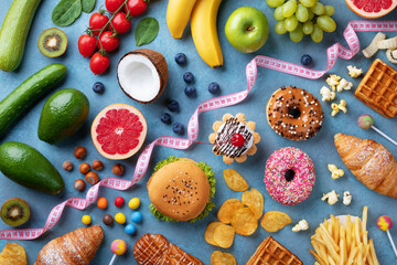 Wall Mural - Healthy and unhealthy food background from fruits and vegetables vs fast food, sweets and pastry top view. Diet and detox against calorie and overweight lifestyle concept.