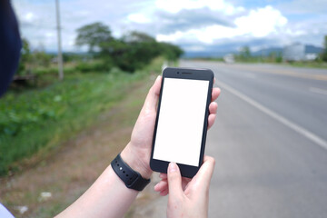 Cropped shot view of business woman’s hands holding the mobile phone with blank copy space screen for your information content or text message.